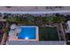 Aerial view of a private backyard pool with umbrellas and meticulously manicured landscaping creating a private oasis at 40195 N Hailey Ln, Queen Creek, AZ 85140