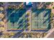Aerial view of community tennis courts surrounded by lush desert landscaping at 40195 N Hailey Ln, Queen Creek, AZ 85140