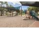 Community playground with shade structures over the slides and play equipment on a sand base at 4426 E Capricorn Pl, Chandler, AZ 85249