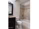 Bathroom features a toilet, vanity, and shower with tile surround at 4436 E Pueblo E Ave, Phoenix, AZ 85040