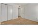 Bedroom featuring carpet, closet with sliding doors, and neutral paint at 4436 E Pueblo E Ave, Phoenix, AZ 85040