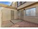Charming front entrance featuring secure doors and a cozy gravel pathway leading up to the home at 4436 E Pueblo E Ave, Phoenix, AZ 85040
