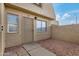 Two-story home with a security door, neutral exterior, and decorative rock landscaping at 4436 E Pueblo E Ave, Phoenix, AZ 85040