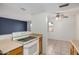 Functional kitchen featuring neutral counters, white appliances, and ample cabinet storage space at 4436 E Pueblo E Ave, Phoenix, AZ 85040