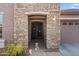 Charming front porch with a stone facade, and a landscaped garden at 4511 E Narrowleaf Dr, Gilbert, AZ 85298