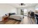 Bright bedroom features a ceiling fan, wood floors, and a sliding door to the backyard at 4530 W Continental Dr, Glendale, AZ 85308