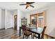 Dining room features wood floors, a sliding glass door, and natural light at 4530 W Continental Dr, Glendale, AZ 85308