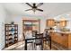 Bright dining area with wood floors and access to the outdoor patio at 4530 W Continental Dr, Glendale, AZ 85308