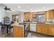 The kitchen features granite counters, wood cabinets, and backyard views at 4530 W Continental Dr, Glendale, AZ 85308