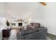 Bright living room features a fireplace, wood beam accent, and wood laminate flooring at 4530 W Continental Dr, Glendale, AZ 85308