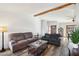 The living room features wood laminate flooring and a view of the home's entry at 4530 W Continental Dr, Glendale, AZ 85308