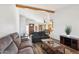 The living room showcases wood laminate flooring and an open layout to the dining area at 4530 W Continental Dr, Glendale, AZ 85308