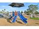 Colorful community playground with slides, climbing structures, and a sunshade for enjoyment at 4530 W Continental Dr, Glendale, AZ 85308