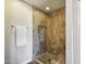 Modern shower with wood tile, glass door and bench at 4530 W Continental Dr, Glendale, AZ 85308