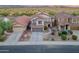 Aerial view of a two-story home featuring a tile roof, desert landscaping, and a two-car garage at 4535 W Cottontail Rd, Phoenix, AZ 85086
