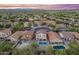 Extensive aerial view of a neighborhood with houses and backyards, each containing a pool at 4535 W Cottontail Rd, Phoenix, AZ 85086