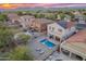 Aerial view of a backyard with a pool, seating area, and neighboring houses at 4535 W Cottontail Rd, Phoenix, AZ 85086