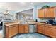A view of the kitchen with stainless steel appliances and blue-patterned flooring at 4535 W Cottontail Rd, Phoenix, AZ 85086
