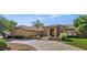 Charming single-story home featuring a lush front yard, desert landscaping, and a grand entrance at 4815 W Desert Hollow Dr, Phoenix, AZ 85083