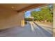 Spacious covered back patio providing shade with scenic backyard views and landscaping at 4937 S Peach Willow Ln, Gilbert, AZ 85298