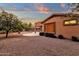 Well-maintained backyard featuring a covered patio and desert-friendly landscaping at 4937 S Peach Willow Ln, Gilbert, AZ 85298