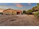 Backyard featuring a covered patio area and gravel landscape at 4937 S Peach Willow Ln, Gilbert, AZ 85298