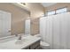 Bathroom featuring a shower, toilet, and a single sink vanity with ample counter space at 4937 S Peach Willow Ln, Gilbert, AZ 85298