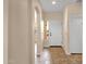 Bright entryway with tiled floors, a white front door, and an arched opening to the living area at 4937 S Peach Willow Ln, Gilbert, AZ 85298
