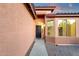View of front entrance leading to the front door with security screen at 4937 S Peach Willow Ln, Gilbert, AZ 85298