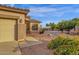 Charming single-story home featuring desert landscaping and a welcoming exterior at 4937 S Peach Willow Ln, Gilbert, AZ 85298