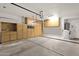 Spacious garage with plenty of storage, including cabinets, overhead racks and a water heater at 4937 S Peach Willow Ln, Gilbert, AZ 85298