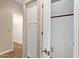 Hallway with closet and neutral colored walls at 4937 S Peach Willow Ln, Gilbert, AZ 85298