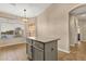 Eat-in kitchen featuring kitchen island with stainless steel appliances, and breakfast nook at 4937 S Peach Willow Ln, Gilbert, AZ 85298