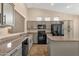 Modern kitchen featuring stainless steel appliances, granite countertops, and plenty of cabinet space at 4937 S Peach Willow Ln, Gilbert, AZ 85298
