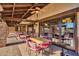 Enjoyable outdoor patio with ceiling fan and views to golf course at 4937 S Peach Willow Ln, Gilbert, AZ 85298