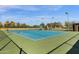 Scenic view of the tennis courts with professional nets and shade areas at 4937 S Peach Willow Ln, Gilbert, AZ 85298