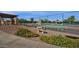 Community tennis courts featuring well maintained grounds and seating areas at 4937 S Peach Willow Ln, Gilbert, AZ 85298