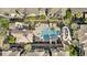 An aerial view showcasing the community pool, lounge chairs, and lush landscaping at 5303 N 7Th St # 215, Phoenix, AZ 85014
