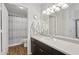 Bathroom showcasing a spacious countertop, ample lighting, and a convenient shower area at 5303 N 7Th St # 215, Phoenix, AZ 85014