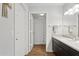 Bright bathroom featuring a modern vanity and shower with a stylish polka dot curtain at 5303 N 7Th St # 215, Phoenix, AZ 85014