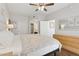 Bedroom showcasing a spacious layout, ceiling fan, and an ensuite bathroom entrance at 5303 N 7Th St # 215, Phoenix, AZ 85014