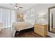 Bright bedroom with a ceiling fan, modern decor, and wood floors at 5303 N 7Th St # 215, Phoenix, AZ 85014