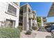Attractive condo building with well-maintained landscaping and convenient parking at 5303 N 7Th St # 215, Phoenix, AZ 85014