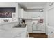 Modern kitchen featuring white cabinets, stainless steel appliances, and sleek countertops at 5303 N 7Th St # 215, Phoenix, AZ 85014