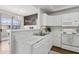 Well-lit kitchen with white cabinetry, modern countertops, and stainless steel sink at 5303 N 7Th St # 215, Phoenix, AZ 85014