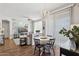 Open concept living area featuring a dining space, wood floors, and natural light at 5303 N 7Th St # 215, Phoenix, AZ 85014