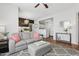 Comfortable living area with a gray sofa, patterned rug, and views of the kitchen and dining space at 5303 N 7Th St # 215, Phoenix, AZ 85014