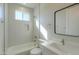 Modern bathroom featuring bright vanity and large shower and bathtub combination at 57856 W Fulcar Rd, Maricopa, AZ 85139