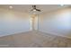 Inviting bedroom boasts carpet, ceiling fan, recessed lighting, and ample space for relaxation and comfort at 57856 W Fulcar Rd, Maricopa, AZ 85139