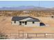 Charming single-story home with desert landscape and mountain views at 57856 W Fulcar Rd, Maricopa, AZ 85139